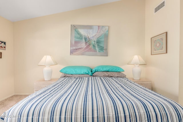 bedroom featuring visible vents, carpet floors, and baseboards