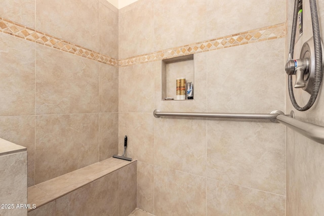 full bath featuring a tile shower