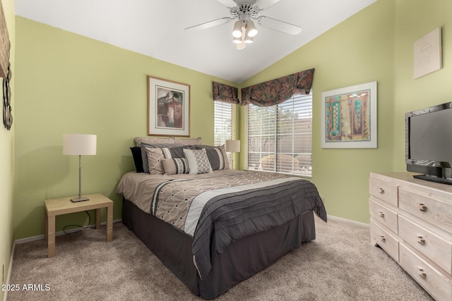 bedroom featuring ceiling fan, lofted ceiling, baseboards, and light carpet