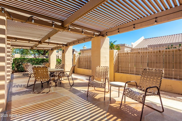 view of patio featuring a pergola, outdoor dining area, and a fenced backyard