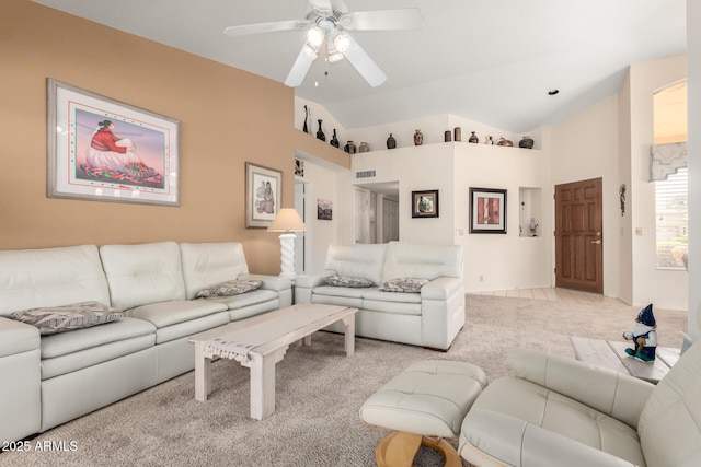 living room with visible vents, light carpet, lofted ceiling, and a ceiling fan