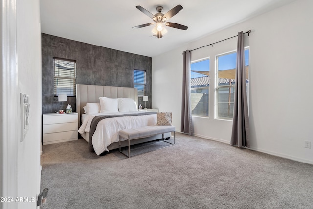 bedroom with light carpet and ceiling fan