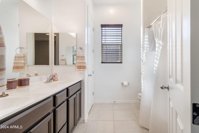 bathroom featuring vanity, toilet, and tile patterned flooring