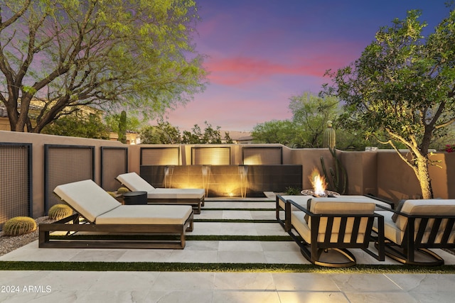 patio terrace at dusk with a fire pit