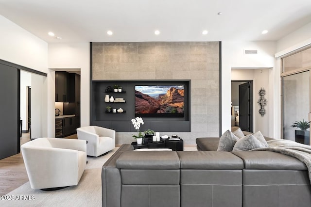 living room with light hardwood / wood-style floors