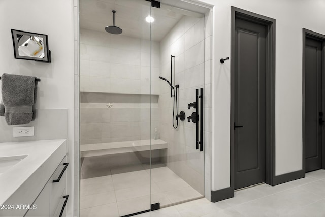 bathroom with vanity, tile patterned floors, and walk in shower