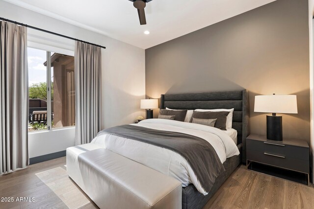 bedroom featuring ceiling fan and light hardwood / wood-style floors