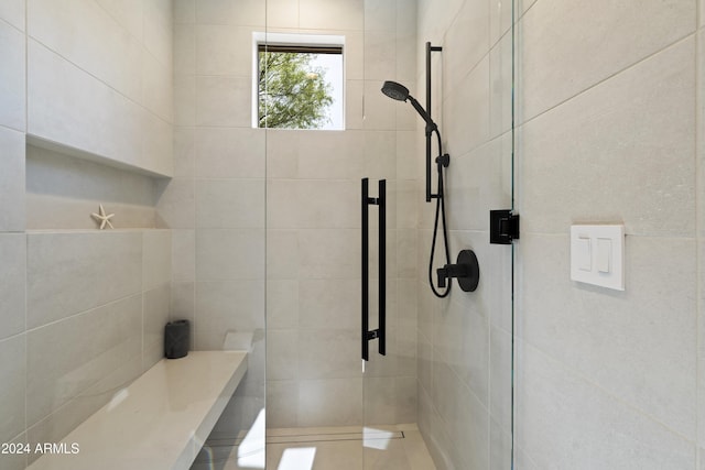 bathroom with a shower with shower door