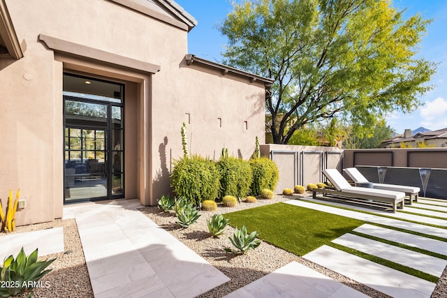 doorway to property featuring a patio