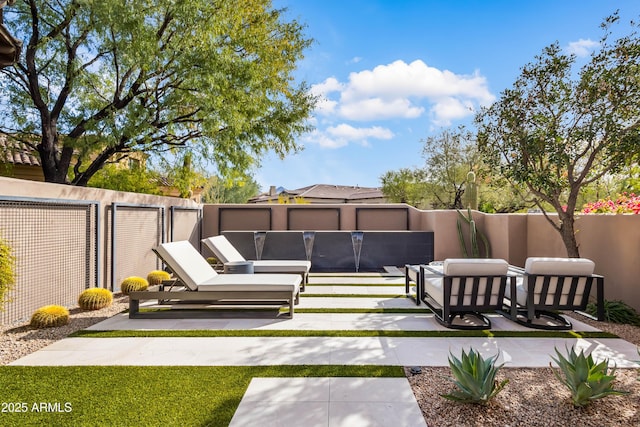 view of yard featuring a patio area and outdoor lounge area