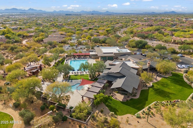 birds eye view of property with a mountain view