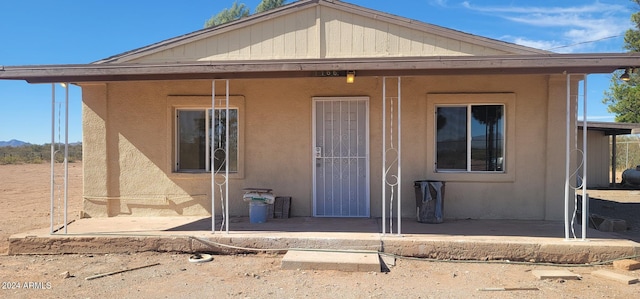1166 N Plantation Rd, Douglas, AZ 85607 - back of house featuring a patio area and stucco siding