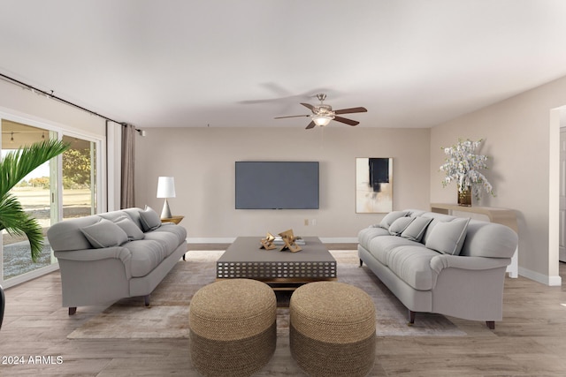 living room with ceiling fan and light wood-type flooring