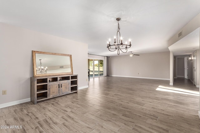 unfurnished living room featuring ceiling fan and wood-type flooring