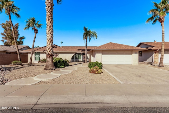 single story home featuring a garage