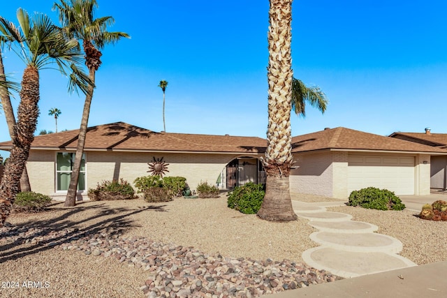 ranch-style home with a garage