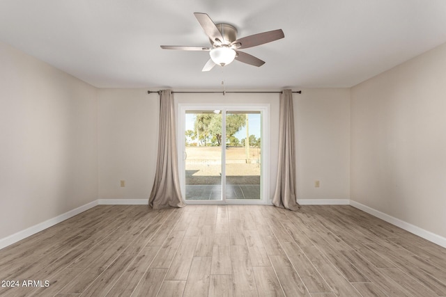 unfurnished room featuring ceiling fan and light hardwood / wood-style flooring