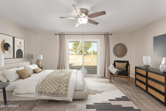 bedroom with ceiling fan, light hardwood / wood-style floors, and access to outside