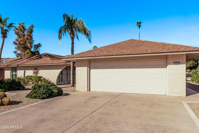 single story home with a garage