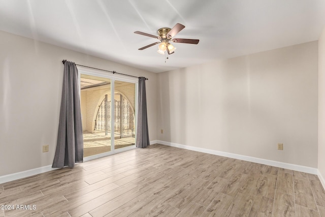 empty room with ceiling fan and light wood-type flooring