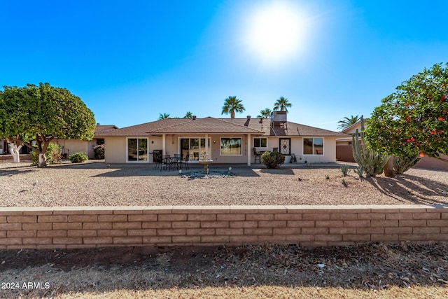 rear view of house featuring a patio