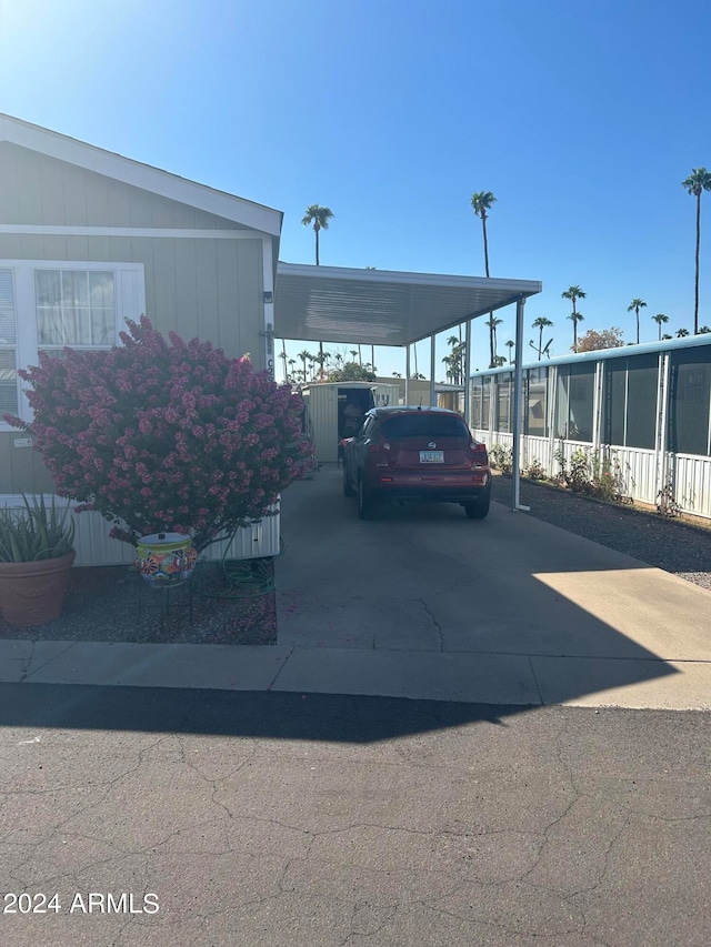 view of vehicle parking featuring a carport