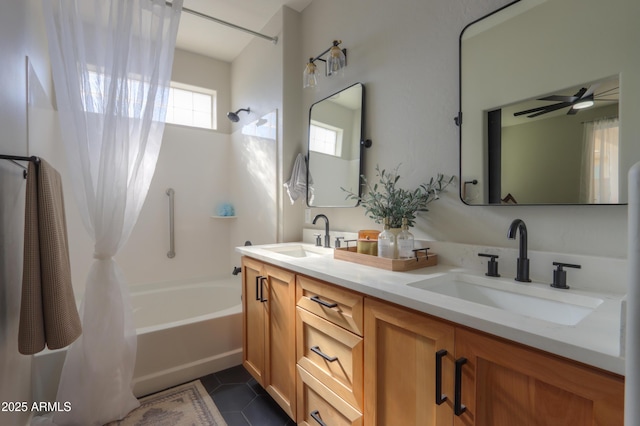 bathroom featuring double vanity, shower / bath combo with shower curtain, a sink, and tile patterned floors