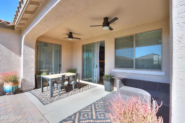 view of patio featuring ceiling fan and outdoor dining area