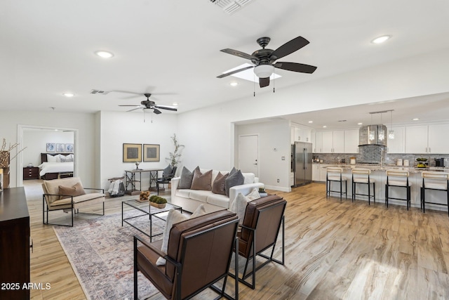 4920 E Osborn Rd, Phoenix, AZ 85018 - living area featuring ceiling fan, recessed lighting, and light wood-style flooring