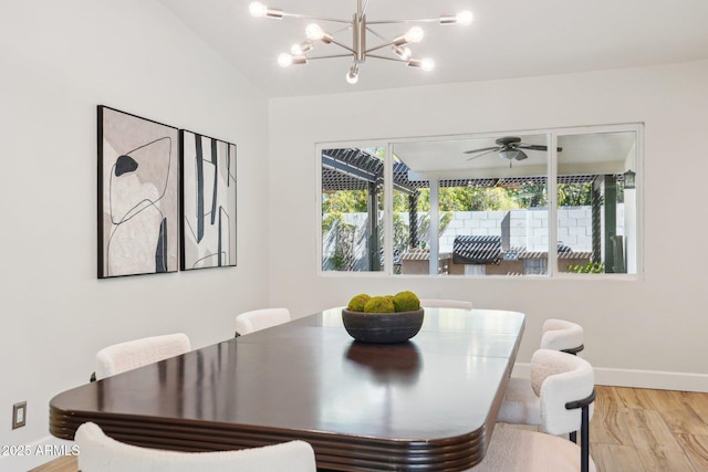 4920 E Osborn Rd, Phoenix, AZ 85018 - dining space featuring light wood-style floors, baseboards, a chandelier, and a ceiling fan