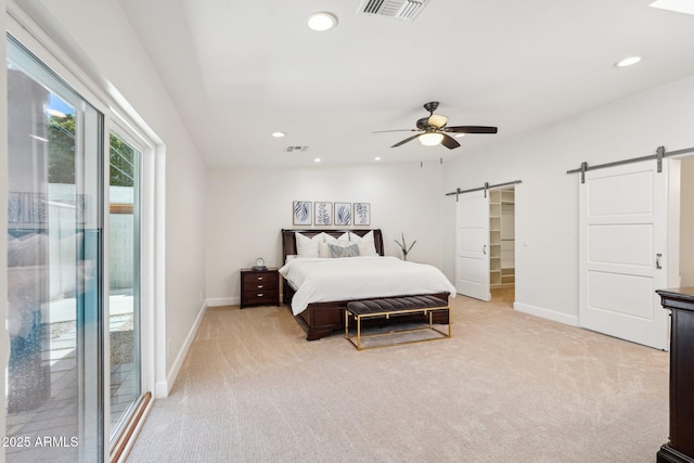 4920 E Osborn Rd, Phoenix, AZ 85018 - bedroom featuring a barn door, access to exterior, light colored carpet, baseboards, and recessed lighting