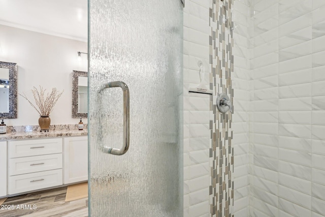 4920 E Osborn Rd, Phoenix, AZ 85018 - bathroom with a shower stall, vanity, and wood finished floors