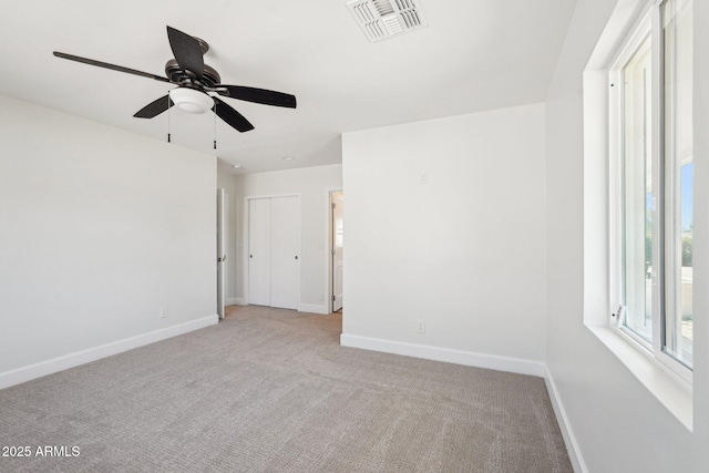 4920 E Osborn Rd, Phoenix, AZ 85018 - unfurnished room featuring light colored carpet, baseboards, and a ceiling fan