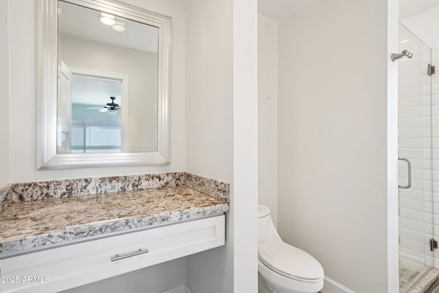 4920 E Osborn Rd, Phoenix, AZ 85018 - full bathroom featuring a stall shower, toilet, vanity, and a ceiling fan