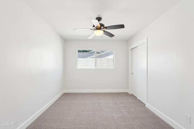 4920 E Osborn Rd, Phoenix, AZ 85018 - empty room featuring light carpet, a ceiling fan, and baseboards