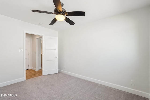 4920 E Osborn Rd, Phoenix, AZ 85018 - spare room featuring light colored carpet, baseboards, and a ceiling fan