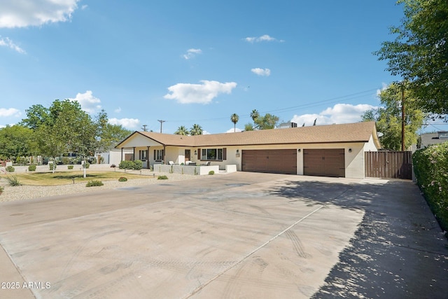 4920 E Osborn Rd, Phoenix, AZ 85018 - ranch-style home featuring an attached garage, driveway, and stucco siding
