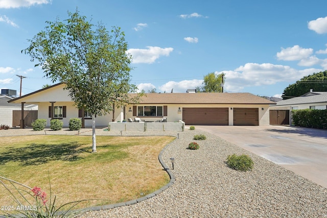 4920 E Osborn Rd, Phoenix, AZ 85018 - ranch-style home featuring concrete driveway, a garage, and stucco siding