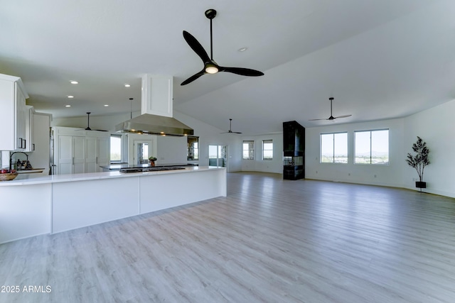 3903 E Melody Dr, Phoenix, AZ 85042 - unfurnished living room with a ceiling fan, light wood finished floors, recessed lighting, high vaulted ceiling, and a sink