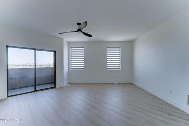 3903 E Melody Dr, Phoenix, AZ 85042 - spare room with ceiling fan, light wood finished floors, and baseboards