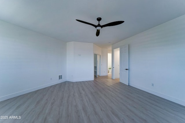 3903 E Melody Dr, Phoenix, AZ 85042 - unfurnished bedroom with wood finished floors, baseboards, and ceiling fan