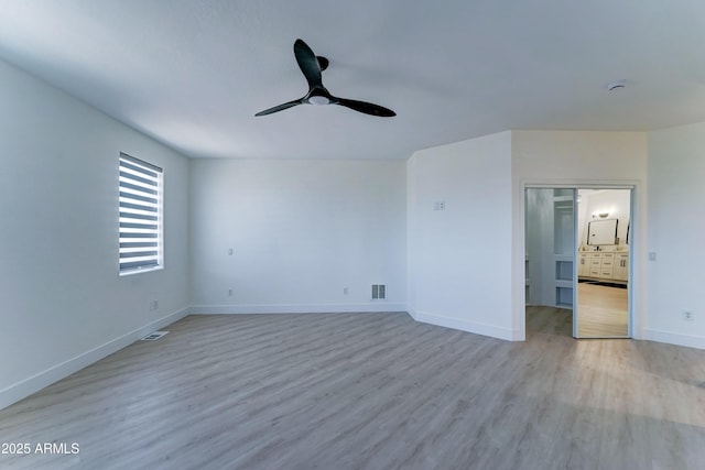 3903 E Melody Dr, Phoenix, AZ 85042 - empty room featuring a ceiling fan, wood finished floors, and baseboards