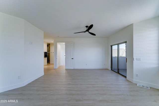 3903 E Melody Dr, Phoenix, AZ 85042 - unfurnished room with a ceiling fan, baseboards, and light wood-style floors