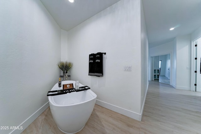 3903 E Melody Dr, Phoenix, AZ 85042 - hallway featuring baseboards, light wood-style floors, and recessed lighting