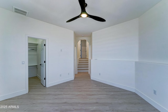 3903 E Melody Dr, Phoenix, AZ 85042 - unfurnished bedroom featuring baseboards, light wood-type flooring, and a spacious closet