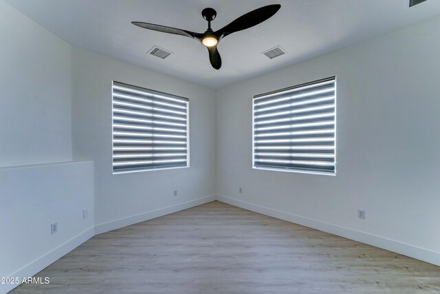 3903 E Melody Dr, Phoenix, AZ 85042 - empty room featuring a ceiling fan, wood finished floors, and baseboards