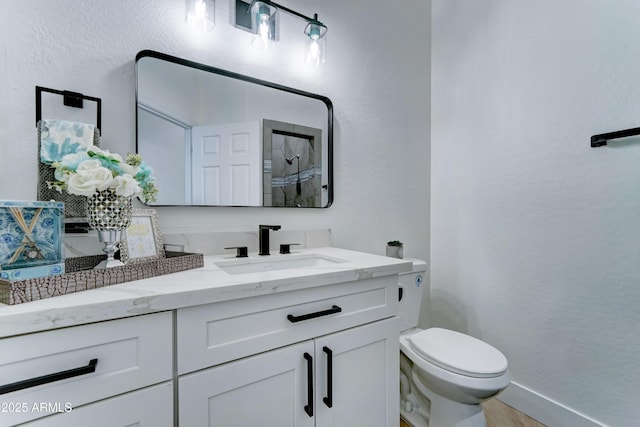 3903 E Melody Dr, Phoenix, AZ 85042 - full bath with toilet, a shower, vanity, a textured wall, and baseboards