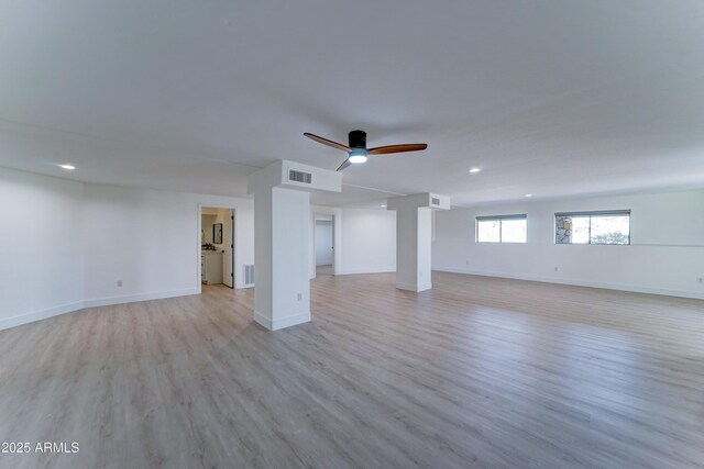 3903 E Melody Dr, Phoenix, AZ 85042 - unfurnished living room featuring light wood-style flooring, a ceiling fan, recessed lighting, and baseboards