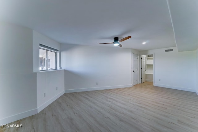 3903 E Melody Dr, Phoenix, AZ 85042 - unfurnished room featuring ceiling fan, light wood finished floors, baseboards, and recessed lighting