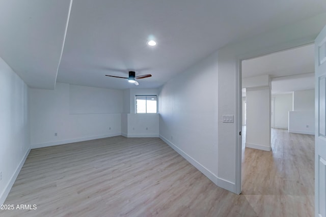 3903 E Melody Dr, Phoenix, AZ 85042 - spare room featuring ceiling fan, baseboards, light wood finished floors, and recessed lighting